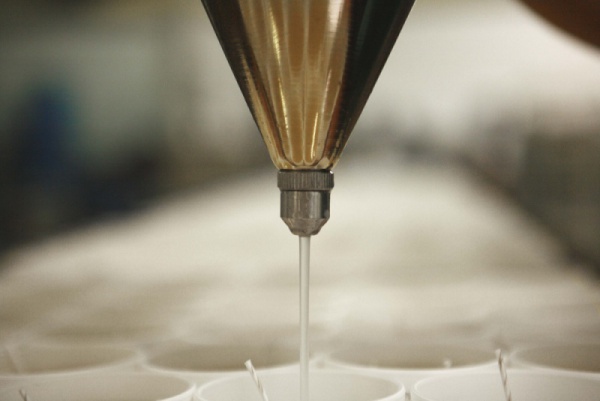 Pouring of scented wax into cutomized glass
